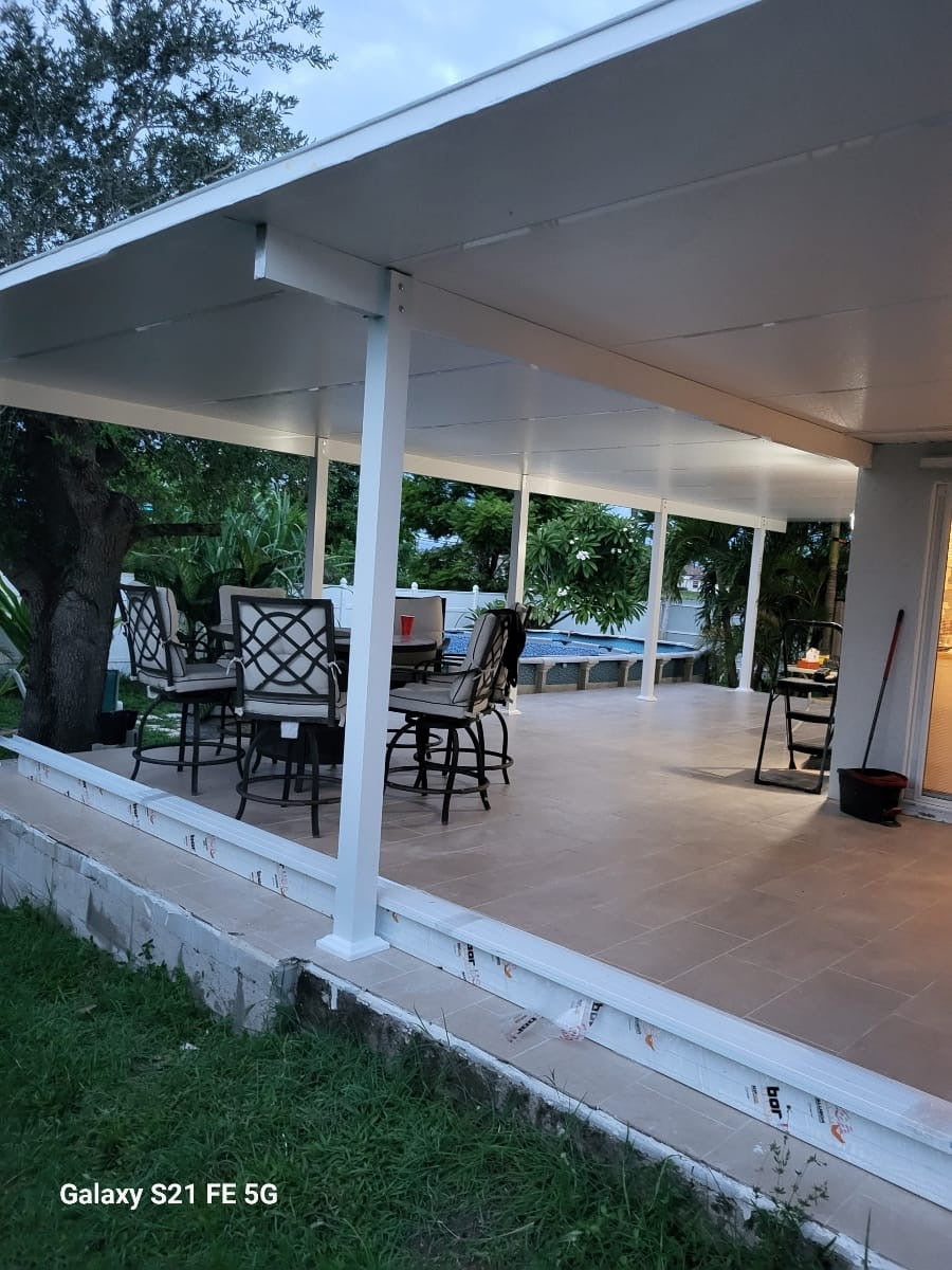 Finished covered patio with tile floor and pool view in Southwest Florida